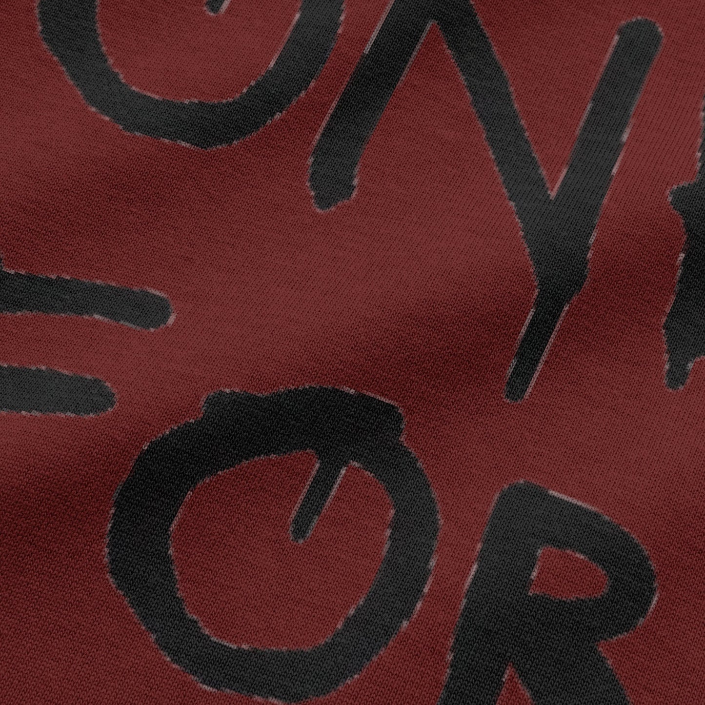 Close-up view of NEED MONEY FOR BMW typography on wine oversized t-shirt by BLAACK