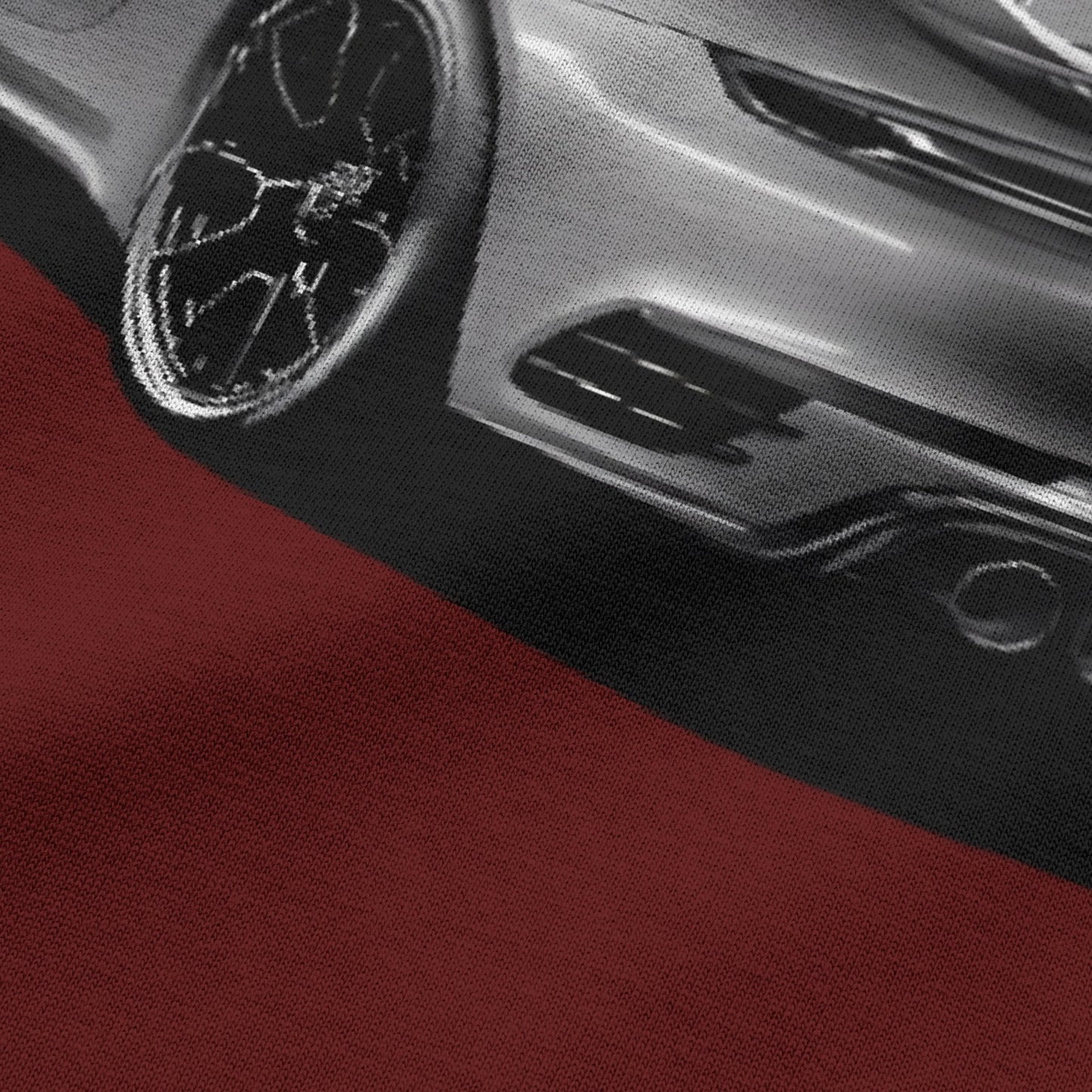 Close-up view of car graphic on wine oversized t-shirt by BLAACK