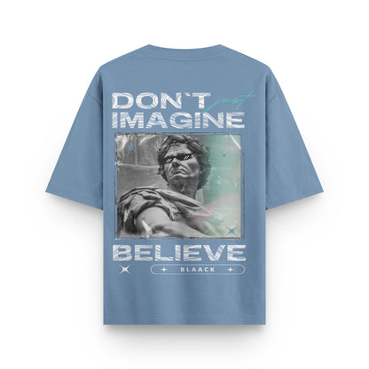 Oversized urban melange streetwear t-shirt with sculpture artwork and "Don’t Just Imagine Believe" text design on back by BLAACK