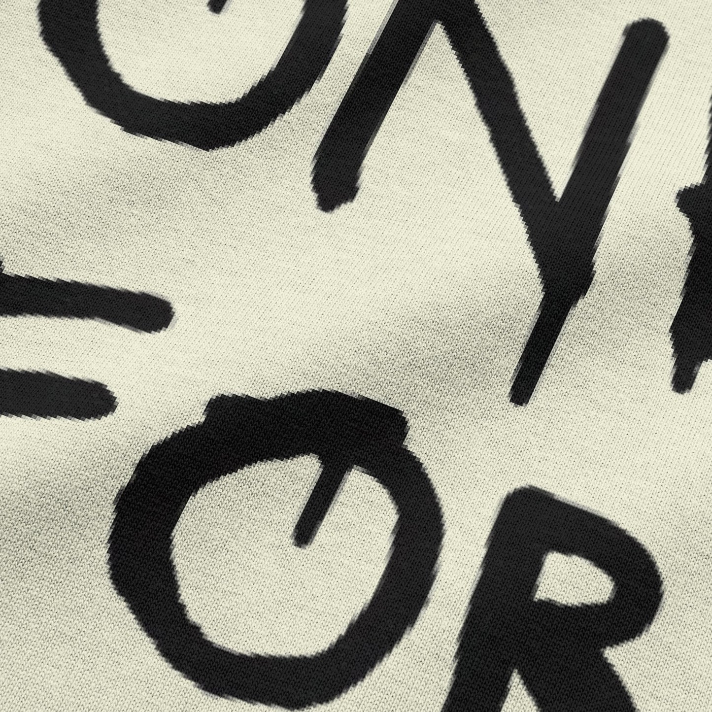 Close-up view of NEED MONEY FOR BMW typography on beige oversized t-shirt by BLAACK