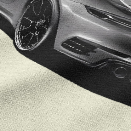 Close-up view of car graphic on beige oversized t-shirt by BLAACK