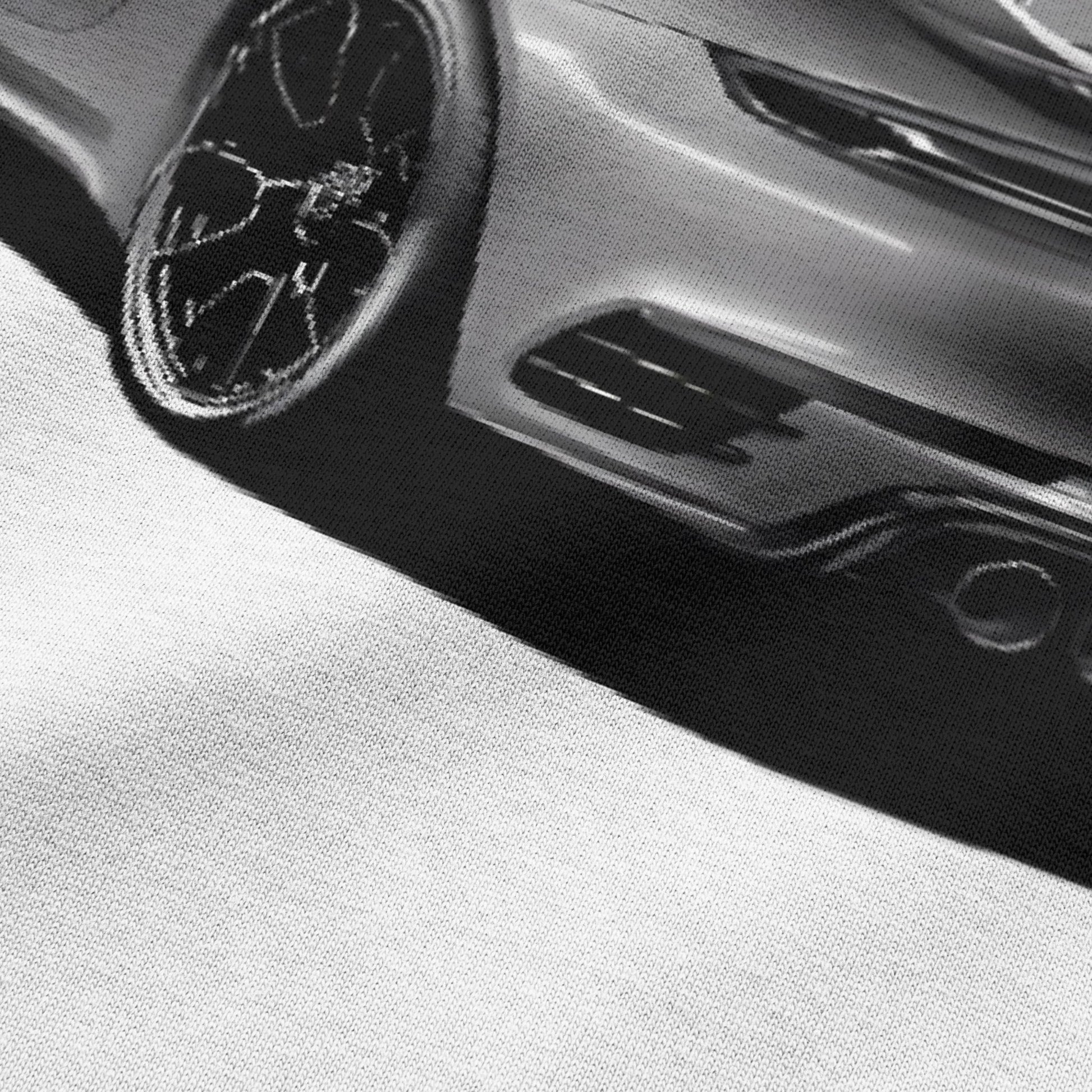 Close-up view of car graphic on white oversized t-shirt by BLAACK