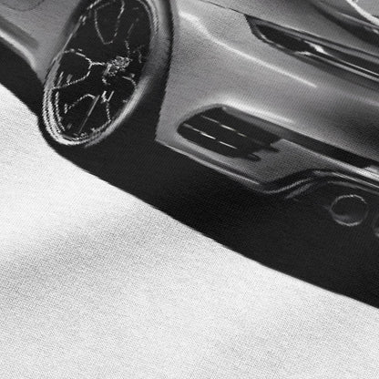 Close-up view of car graphic on white oversized t-shirt by BLAACK