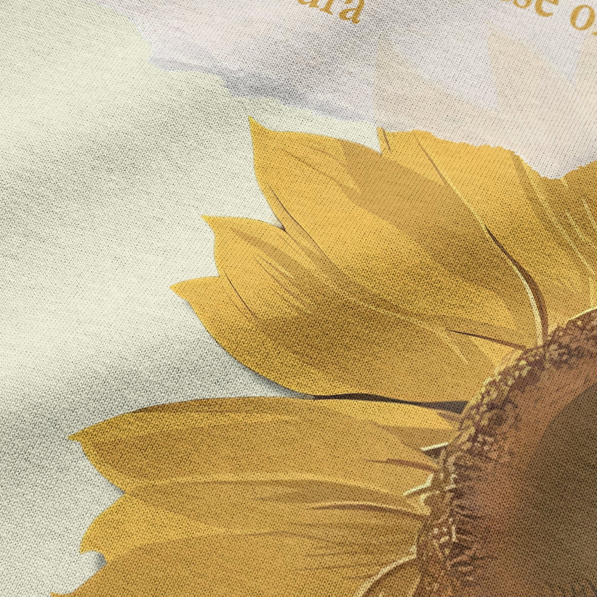 Close-up of sunflower graphic print on beige oversized t-shirt by BLAACK