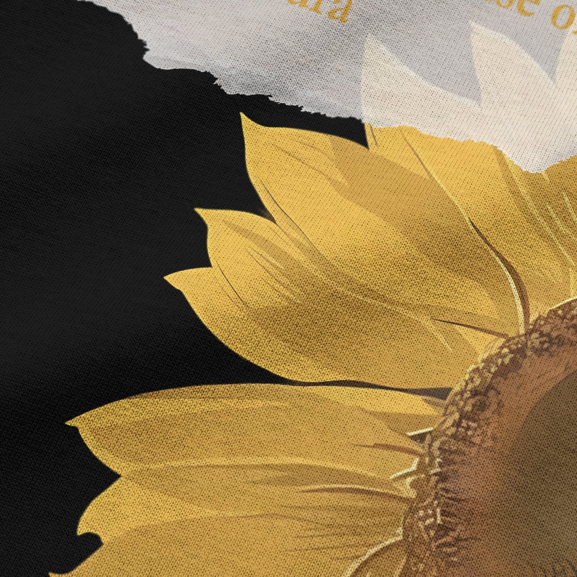 Close-up of sunflower graphic print on black oversized t-shirt by BLAACK
